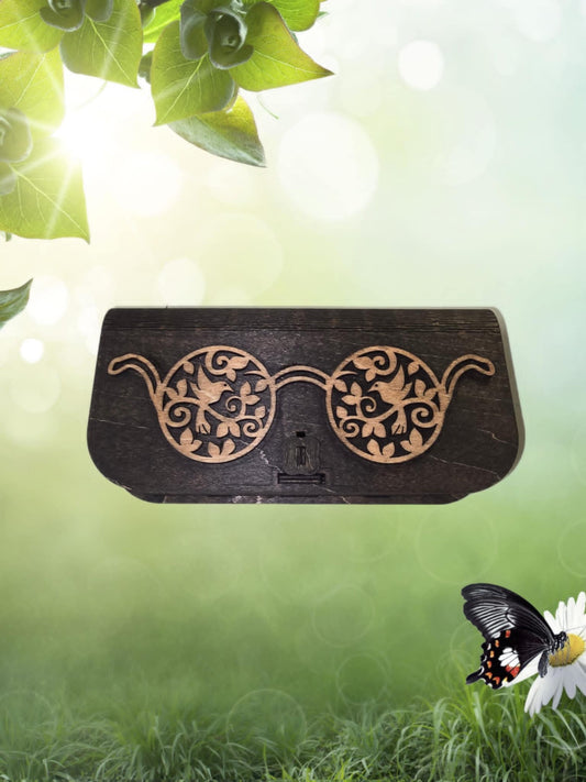 Laser-engraved wooden eyeglass case with rustic design and secure closure.