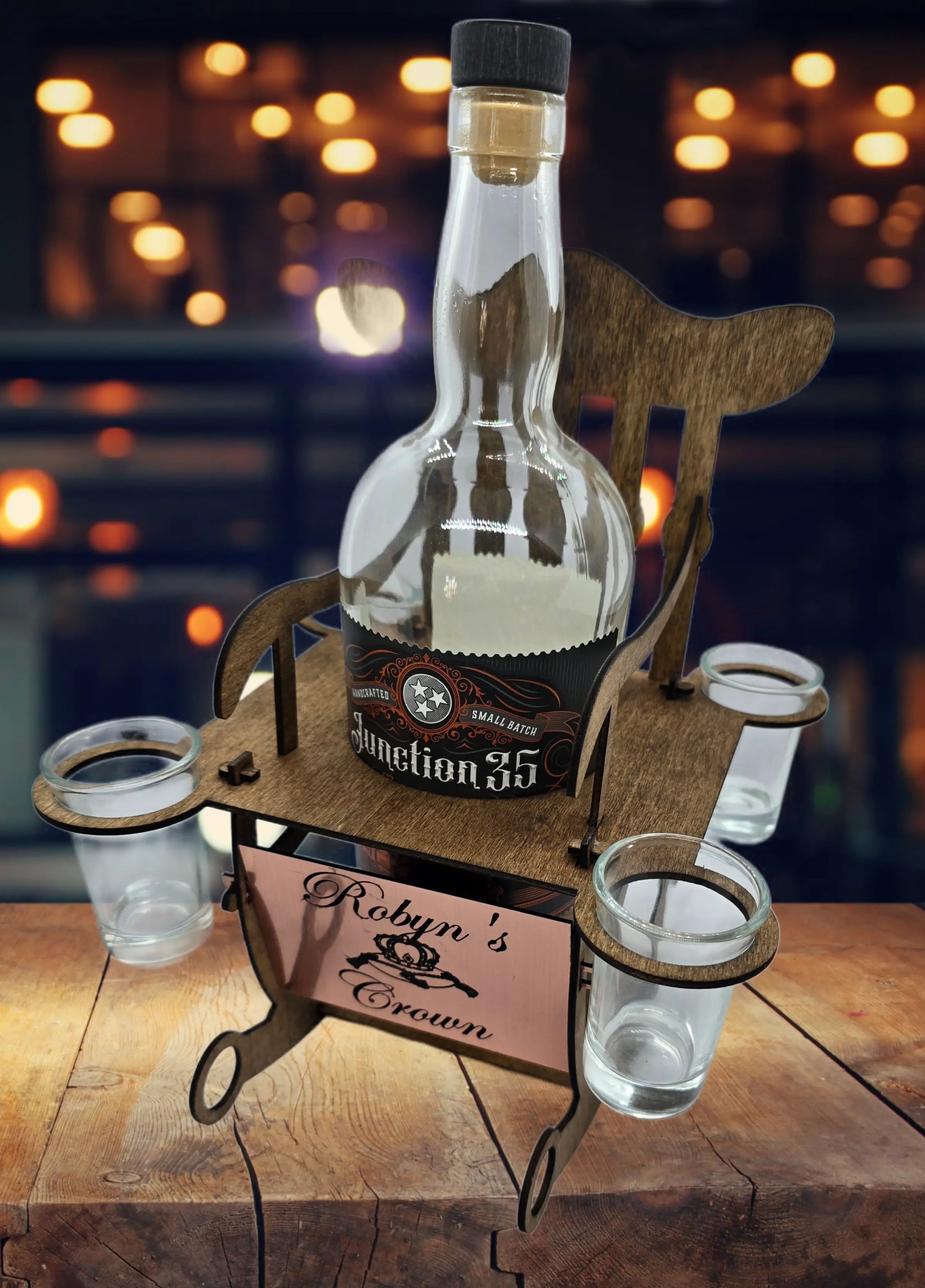 Personalized wooden bottle display with rocking chair design for wine or liquor.