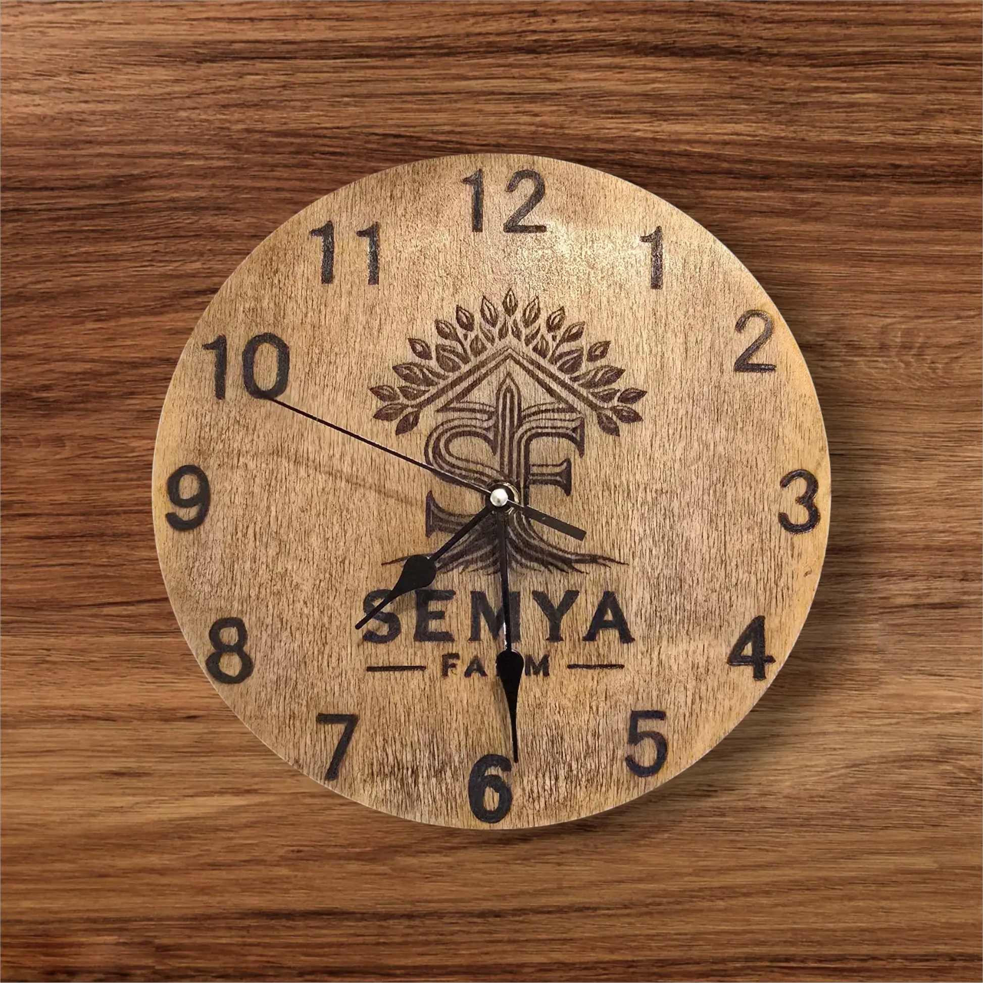 Nature-inspired wooden wall clock with detailed laser engraving and rustic finish.